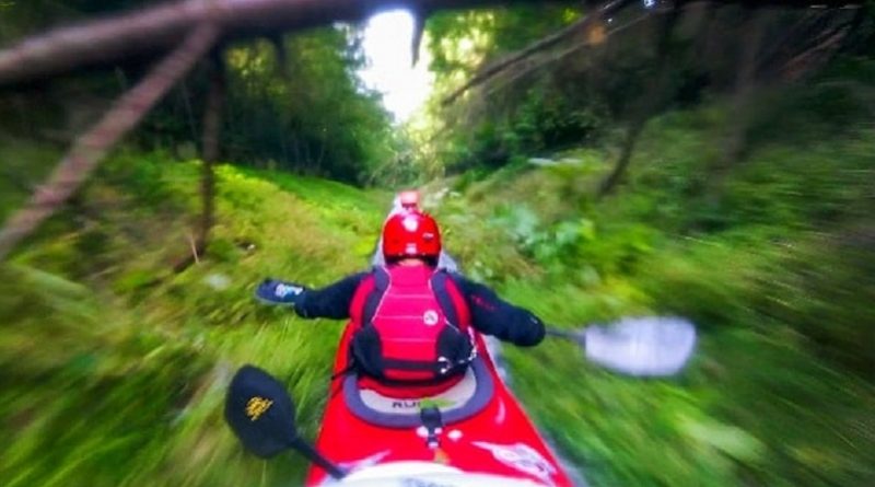 Riding a Kayak Down a Mountain in a Ditch